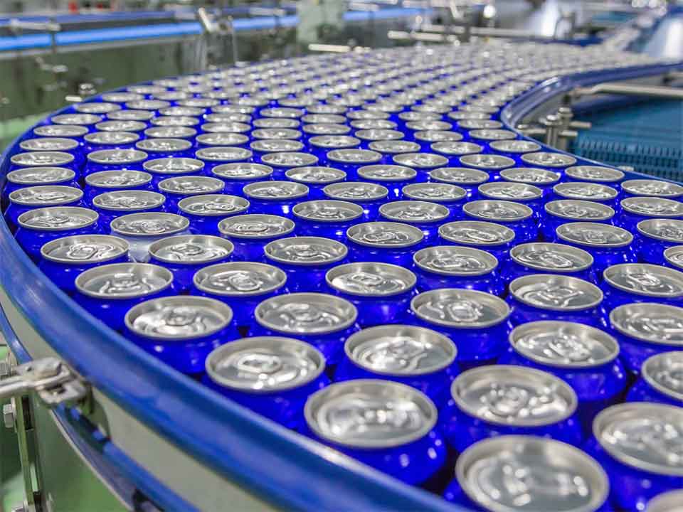 Blue cans on production line